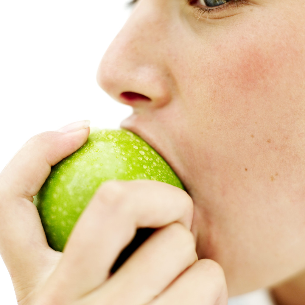 Woman eating an apple