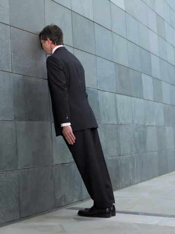 http://www.gettyimages.com/detail/photo/businessman-leaning-forward-resting-face-against-royalty-free-image/200397972-001