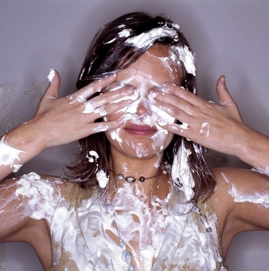 http://m.inmagine.com/image-ptg02264104-Young-Woman-Wiping-Whipped-Cream-from-Her-Face.html